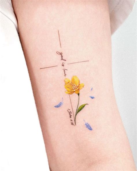 dainty floral cross tattoo|feminine cross with flowers tattoo.